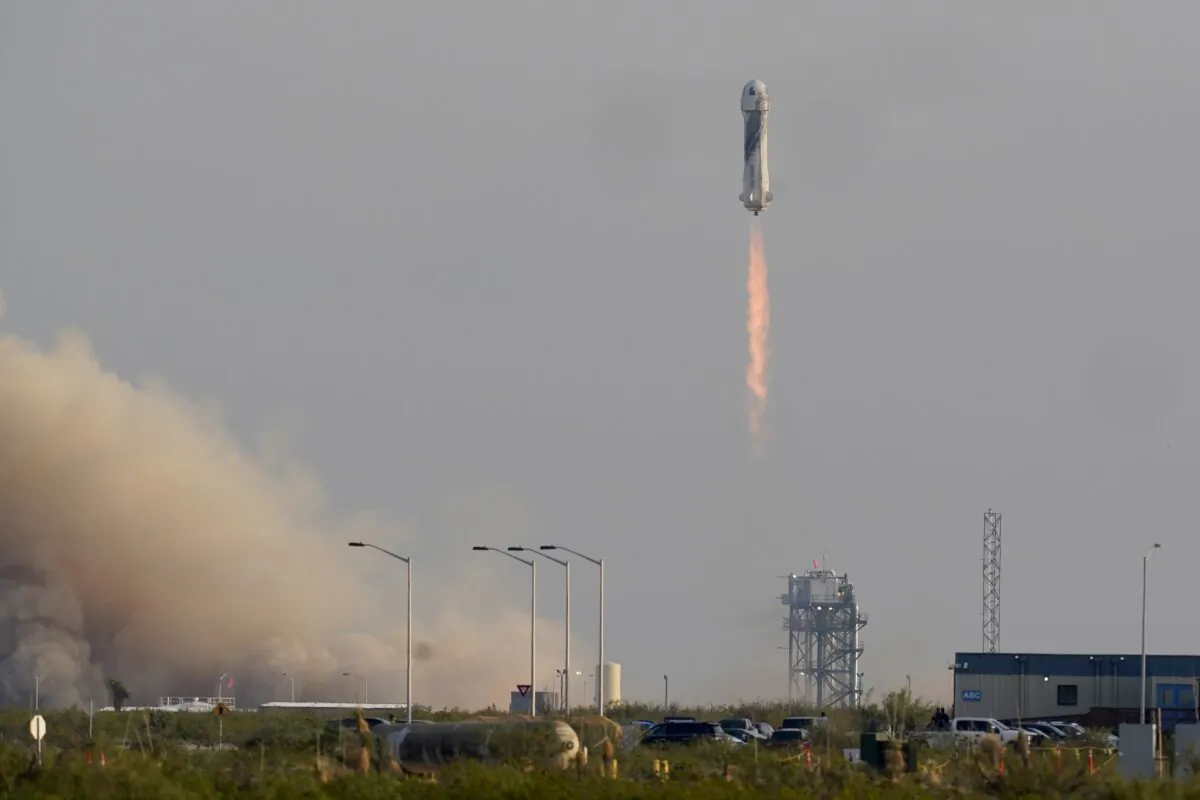 Blue Origin's New Shepard rocket launches carrying passengers Jeff Bezos, founder of Amazon and space tourism company Blue Origin, brother Mark Bezos, Oliver Daemen and Wally Funk, from its spaceport near Van Horn, Texas, on July 20, 2021. (Tony Gutierrez/AP Photo)