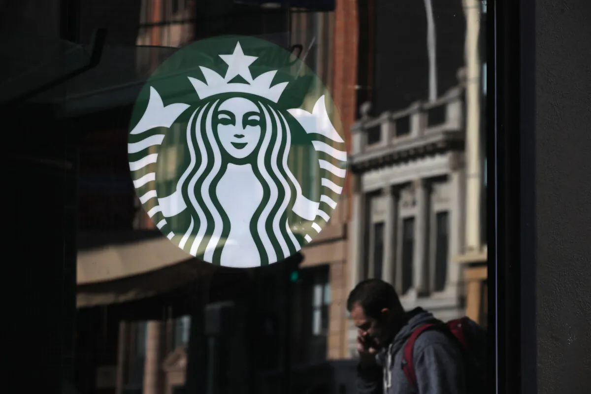 The Starbucks logo is displayed in the window of a Starbucks Coffee shop in San Francisco on Jan. 24, 2019. (Justin Sullivan/Getty Images)