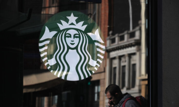 The Starbucks logo is displayed in the window of a Starbucks Coffee shop in San Francisco on Jan. 24, 2019. (Justin Sullivan/Getty Images)