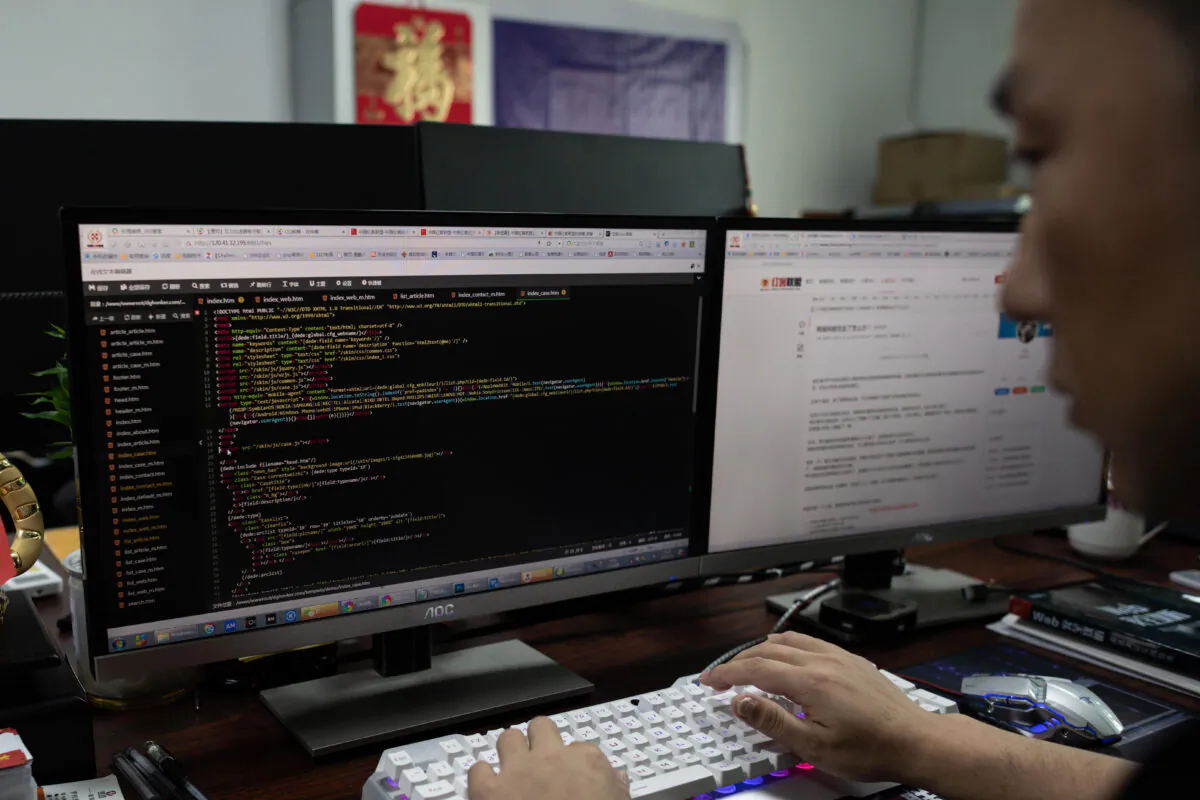 Prince, a member of the hacking group Red Hacker Alliance who refused to give his real name, uses his computer at their office in Dongguan, in China's southern Guangdong Province, on Aug. 4, 2020. (Nicolas Asfouri/AFP via Getty Images)