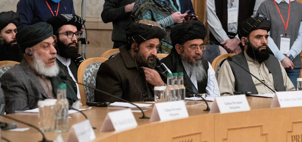 Mullah Abdul Ghani Baradar, Taliban's deputy leader and negotiator, and other delegation members attend the Afghan peace conference in Moscow, Russia, on March 18, 2021. (Alexander Zemlianichenko/Pool via Reuters)