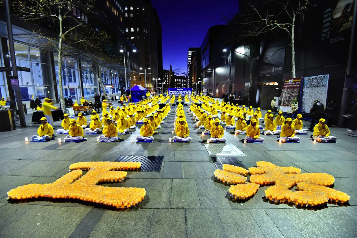 Falun Dafa practitioners commemorate lives lost and 20 years of persecution by the Chinese Communist Party in Sydney's Martin Place, Australia, on July 20, 2018. (The Epoch Times)
