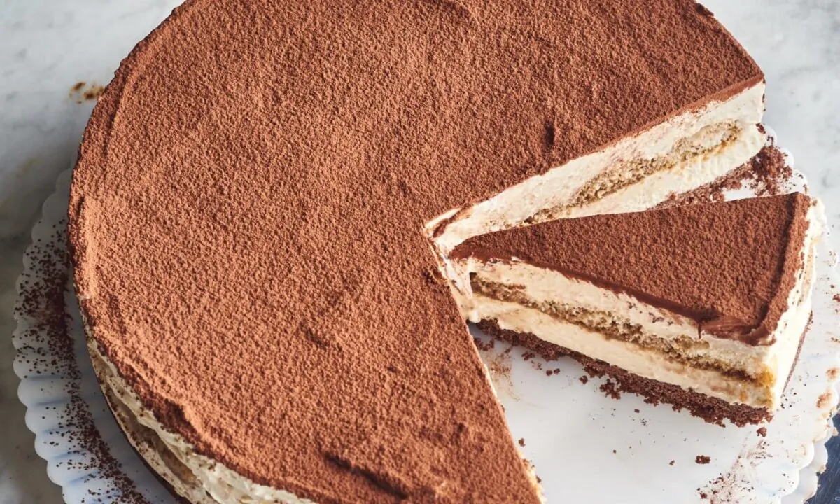 The layer of coffee-soaked ladyfingers is a lovely surprise inside the center of the cake. (Joe Lingeman/TNS)