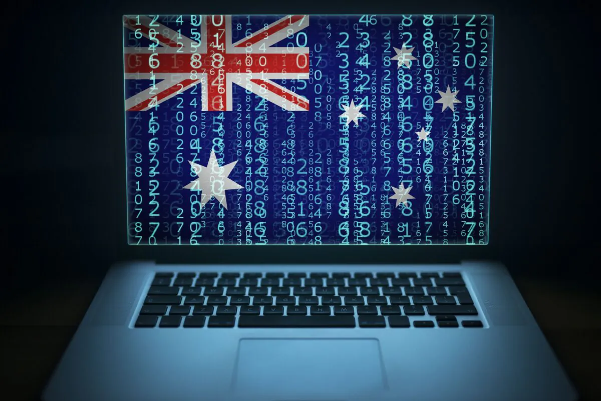 Laptop with binary code and Australia flag on the screen. (littlewolf1989/AdobeStock)