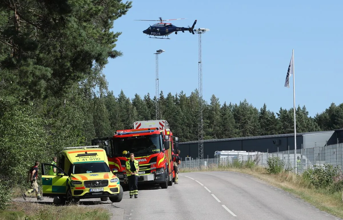 A large police operation with police, fire and rescue service and a police helicopter is underway outside Hallby Prison near Eskilstuna, Sweden, on July 21, 2021. (Per Karlsson/TT via AP)