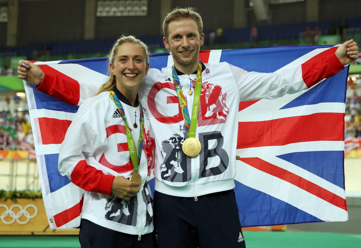 Gold medalist Jason Kenny of Britain poses with his girlfriend, women's omnium gold medalist Laura Trott of Britain, after the Men's Keirin Finals race on Day 11 of the Rio 2016 Olympic Games at the Rio Olympic Velodrome in Rio de Janeiro, Brazil, on Aug. 16, 2016. (Matthew Childs/Reuters)