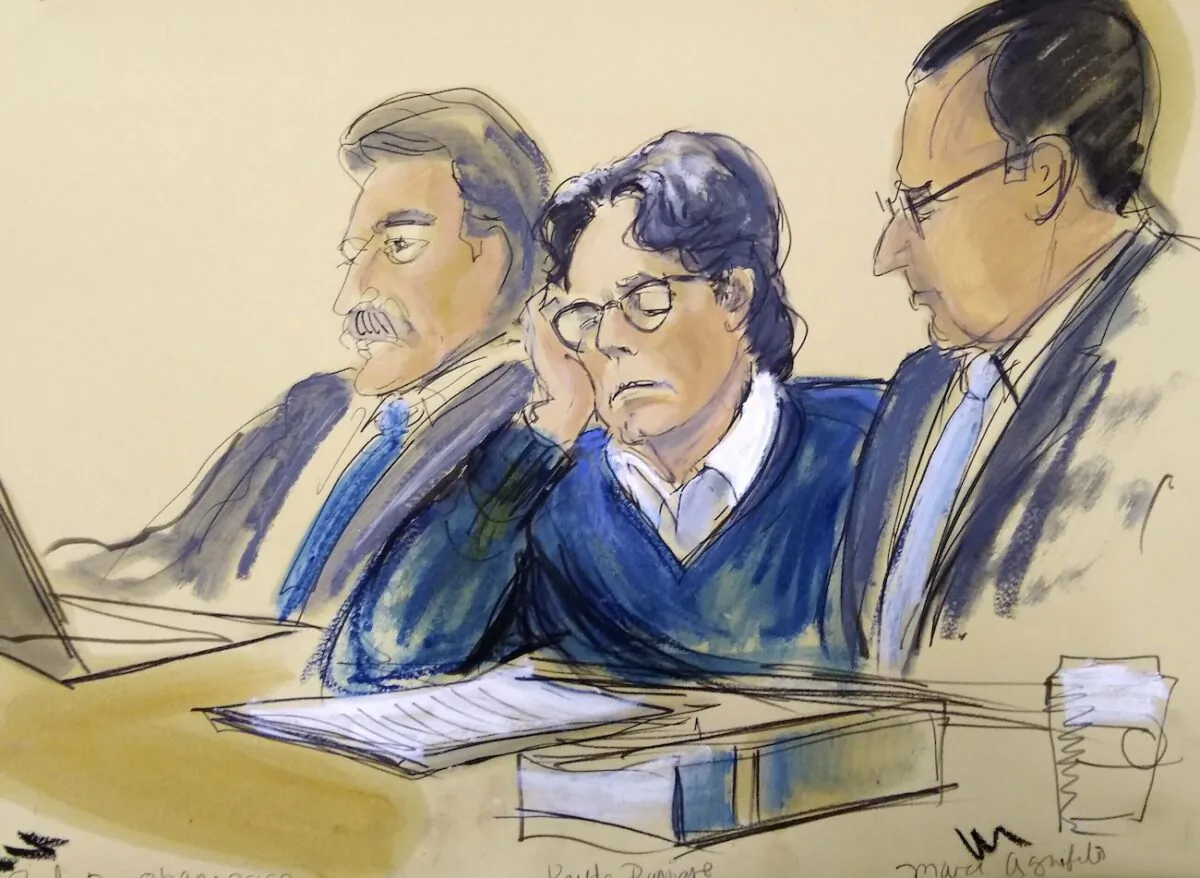 Keith Raniere, center, sits with attorneys Paul DerOhannesian, left, and Marc Agnifilo during closing arguments at Brooklyn federal court in New York, on June 18, 2019. (File courtroom artist's sketch/ Elizabeth Williams via AP)