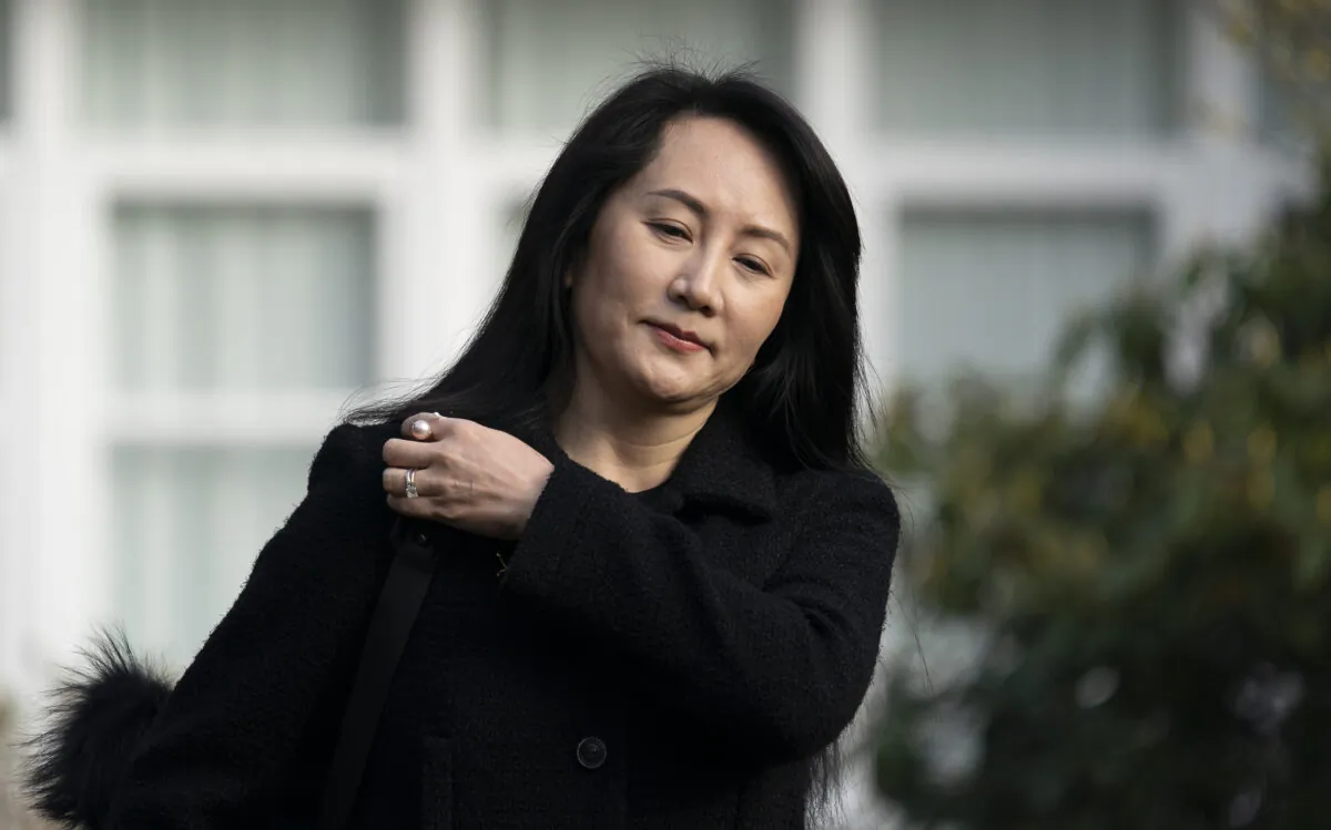 Chief Financial Officer of Huawei, Meng Wanzhou leaves her home in Vancouver to go to B.C. Supreme Court on March 25, 2021. (The Canadian Press/Jonathan Hayward)