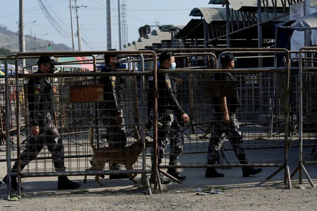 Security forces enter Litoral Penitentiary after deadly fights inside in Guayaquil, Ecuador, on July 22, 2021. (Dolores Ochoa/AP Photo)