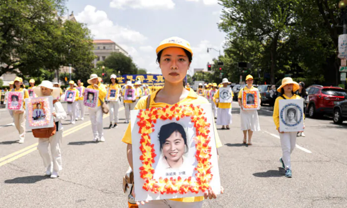 Falun Gong practitioners take part in a parade marking the 22nd anniversary of the start of the Chinese regime’s persecution of Falun Gong in Washington on July 16, 2021. (Samira Bouaou/The Epoch Times)