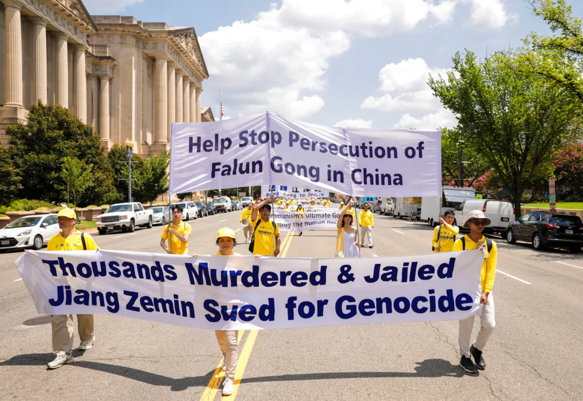Falun Gong practitioners take part in a parade marking the 22nd anniversary of the start of the Chinese regime’s persecution of Falun Gong, in Washington on July 16, 2021. (Samira Bouaou/The Epoch Times)