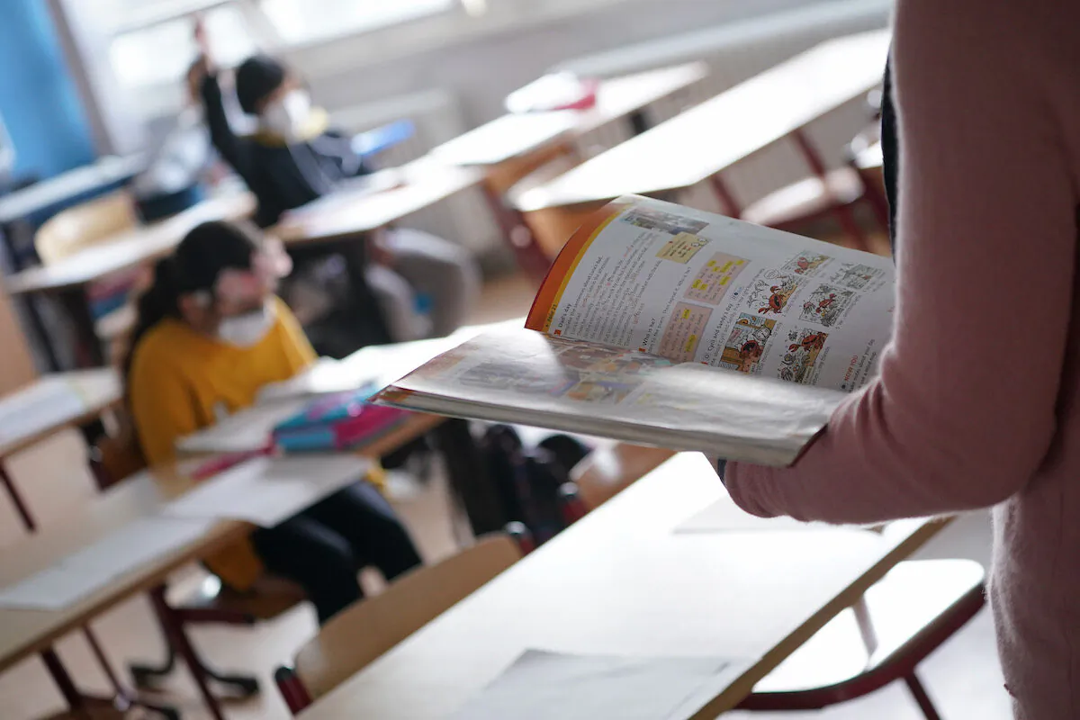 A teacher leads an English class on the first day the children were allowed to return this year for in-person classes at a school during the coronavirus pandemic in Berlin, Germany on March 9, 2021. (Sean Gallup/Getty Images)