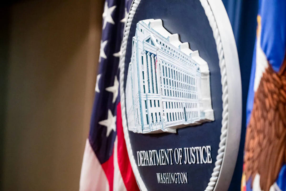 The U.S. Department of Justice seal on the stage at the U.S. Department of Justice in Washington, on Dec. 5, 2019. (Samuel Corum/Getty Images)