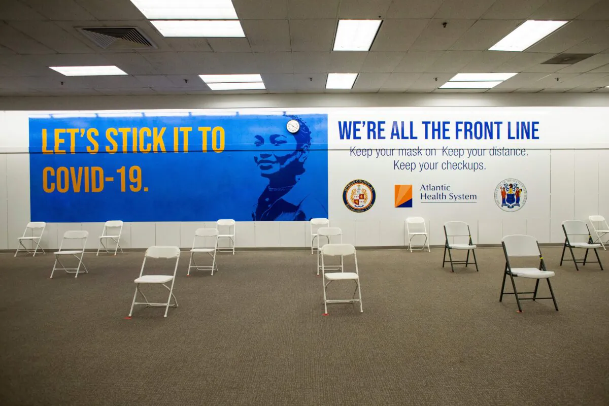 A sign is displayed in the registration area of a COVID-19 vaccination site at the Townsquare Mall in Rockaway, N.J., on Jan. 8, 2021. (Kena Betancur/AFP via Getty Images)