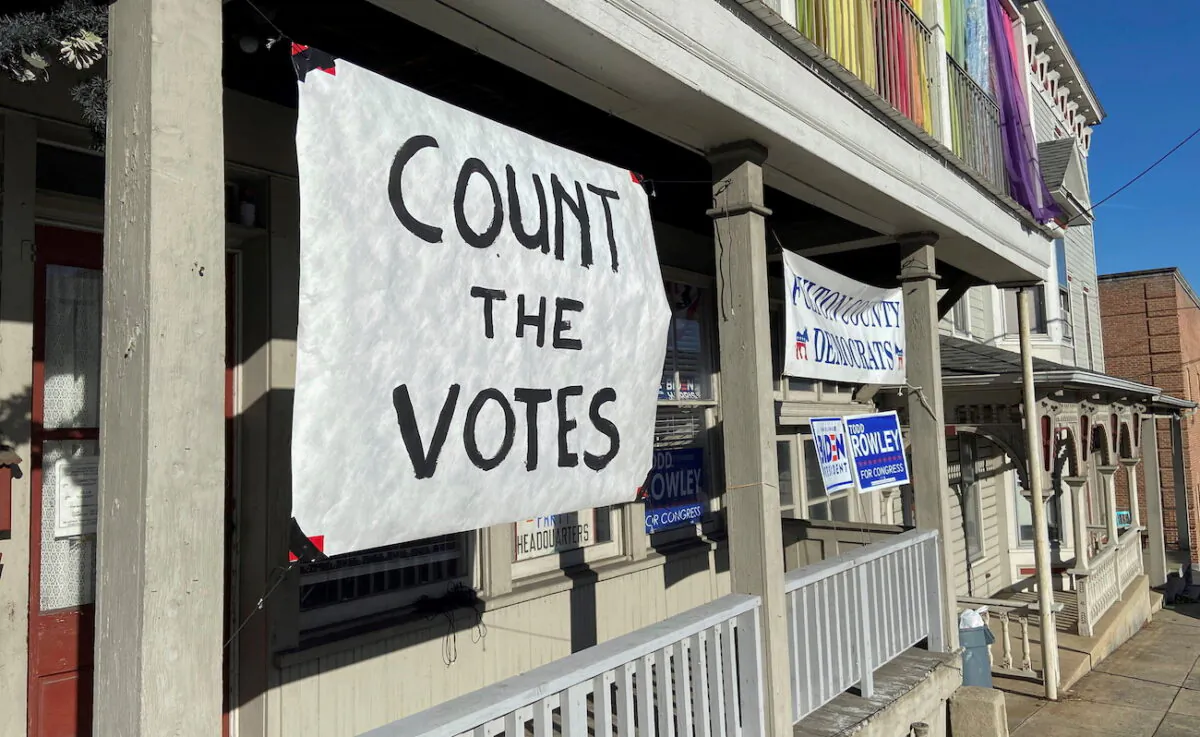 A sign is seen on the porch of the Democratic Party's Fulton County headquarters on Election Day in McConnellsburg, Pennsylvania, on Nov. 3, 2020. (Nathan Layne/Reuters)