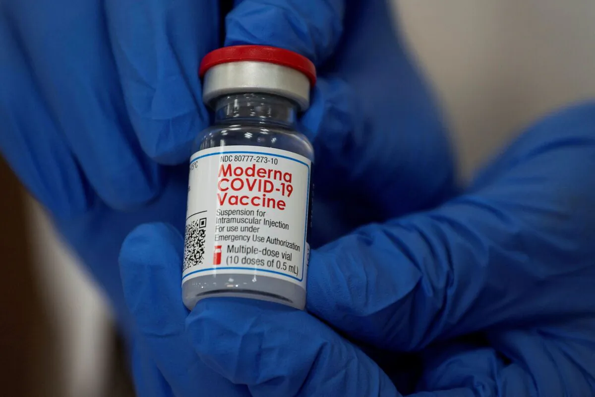 An employee shows the Moderna coronavirus disease (COVID-19) vaccine at Northwell Health's Long Island Jewish Valley Stream hospital in New York, on Dec. 21, 2020. (Eduardo Munoz/Reuters)