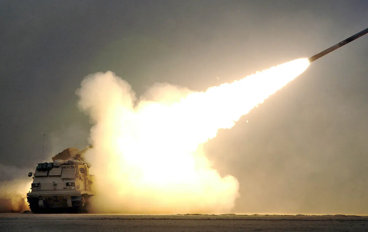 A U.S. Army 3rd Infantry Division, 1st Battallion, 39th Field Artillery Regiment (1-39) Bravo Battery Multiple Launch Rocket System (MLRS) vehicle fires a M28A1 practice rocket during exercises near the Iraqi border in northern Kuwait on Feb. 13, 2003. (Scott Nelson/Getty Images)