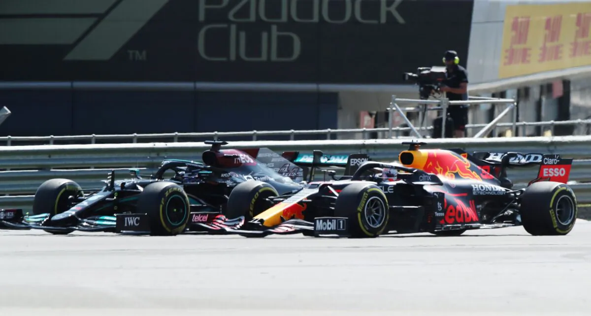 Mercedes' Lewis Hamilton and Red Bull's Max Verstappen during the race of British Formula One Grand Prix, at the Silverstone circuit, in Silverstone, England, on July 18, 2021. (Peter Cziborra/Reuters)