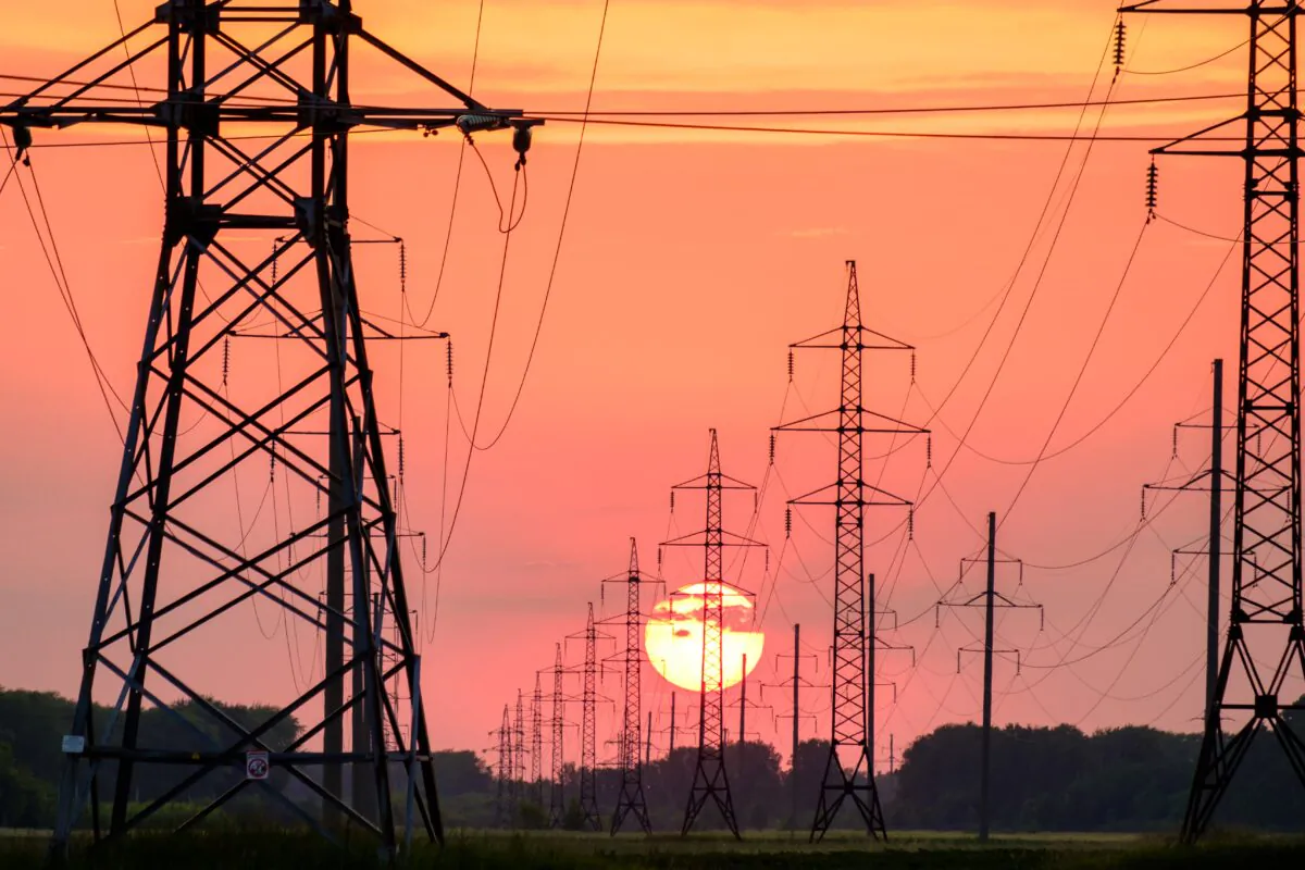 Transmission lines at dusk. (Andrey Metelev / Unsplash)