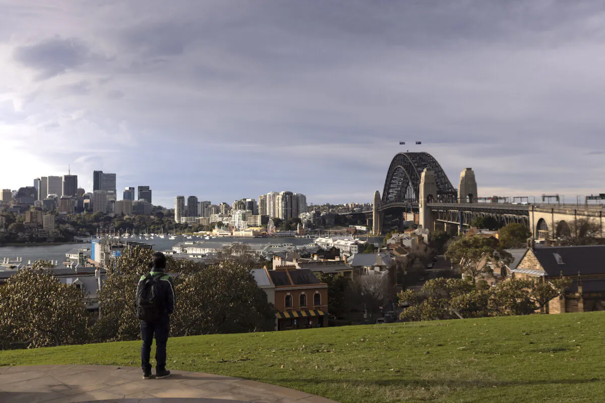 A person looks out over the Harbour Bridge from Observatory Hill in Sydney, Australia on July 20, 2021. (Brook Mitchell/Getty Images)