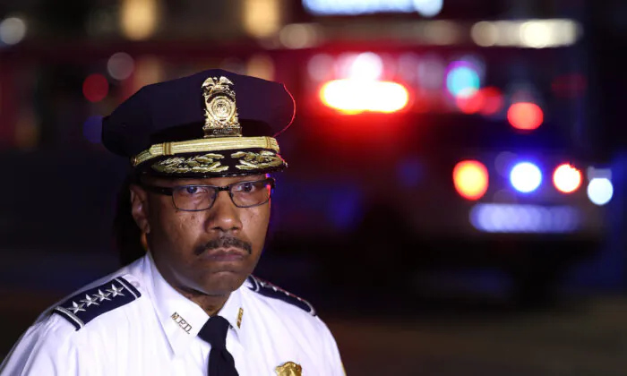 Police Chief Robert Contee speaks to reporters, with Washington Mayor Muriel Bowser, after a shooting in the District of Columbia, on July 22, 2021. (Anna Moneymaker/Getty Images)