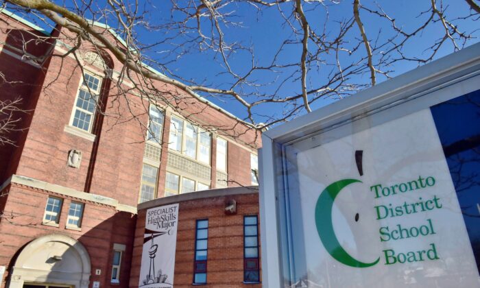 A Toronto District School Board logo is seen on a sign in front of a high school in Toronto in a file photo. (The Canadian Press/Frank Gunn)