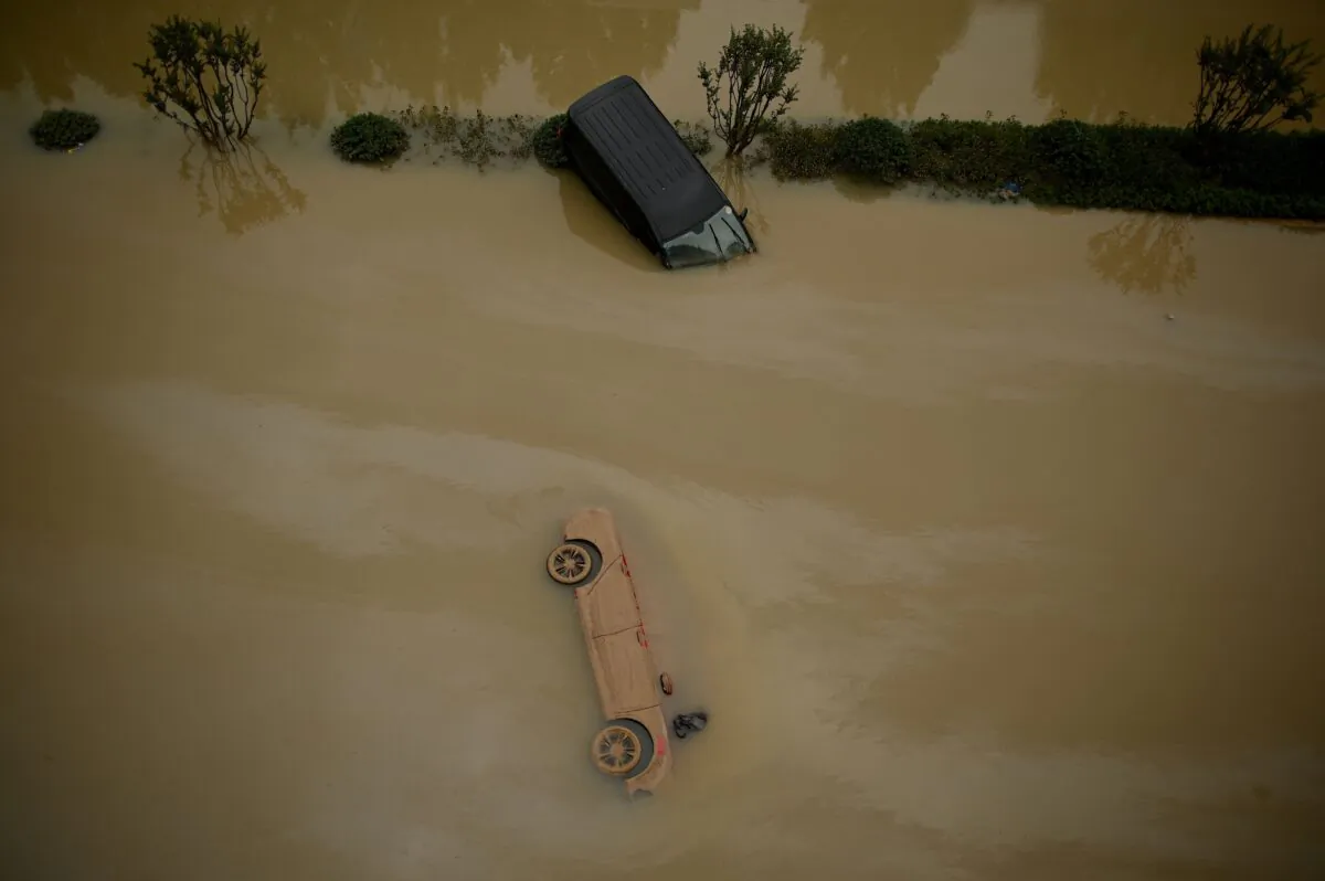 Cars sit in floodwaters following heavy rains, in Zhengzhou in China's central Henan province on July 22, 2021. (Noel Celis/AFP via Getty Images)