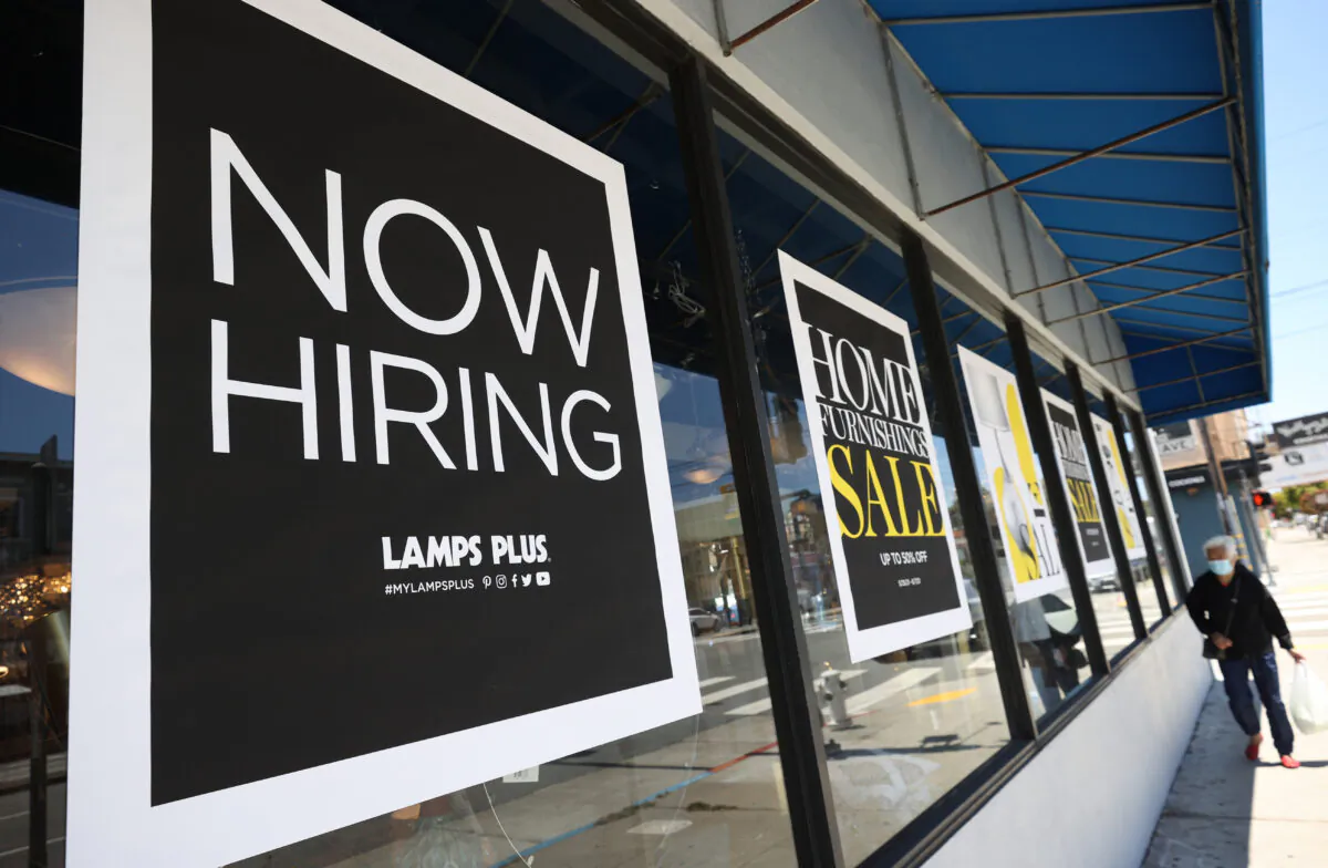 A Now Hiring sign is seen in this file photo. (Justin Sullivan/Getty Images)