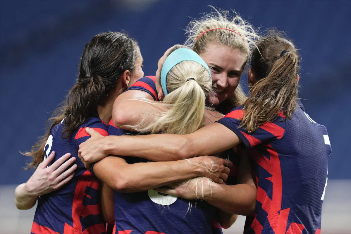 United States' Lindsey Horan, second from right, celebrates after scoring a goal during a women’s soccer match against New Zealand at the 2020 Summer Olympics in Saitama, Japan, on July 24, 2021. (Martin Mejia/AP Photo)