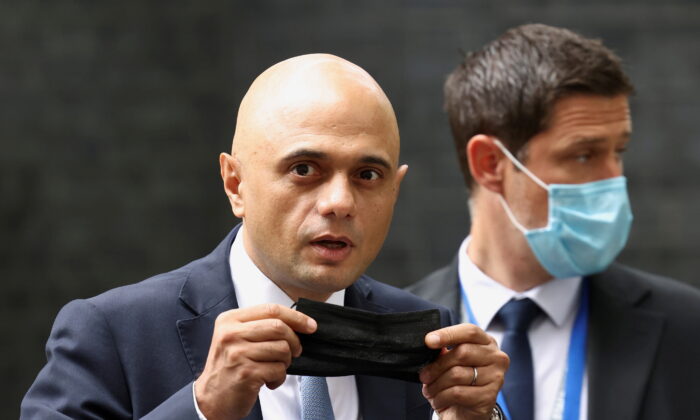 Britain's Health Secretary Sajid Javid holds a face mask, as he leaves the Downing Street in London, Britain, on June 30, 2021. (Henry Nicholls/Reuters)