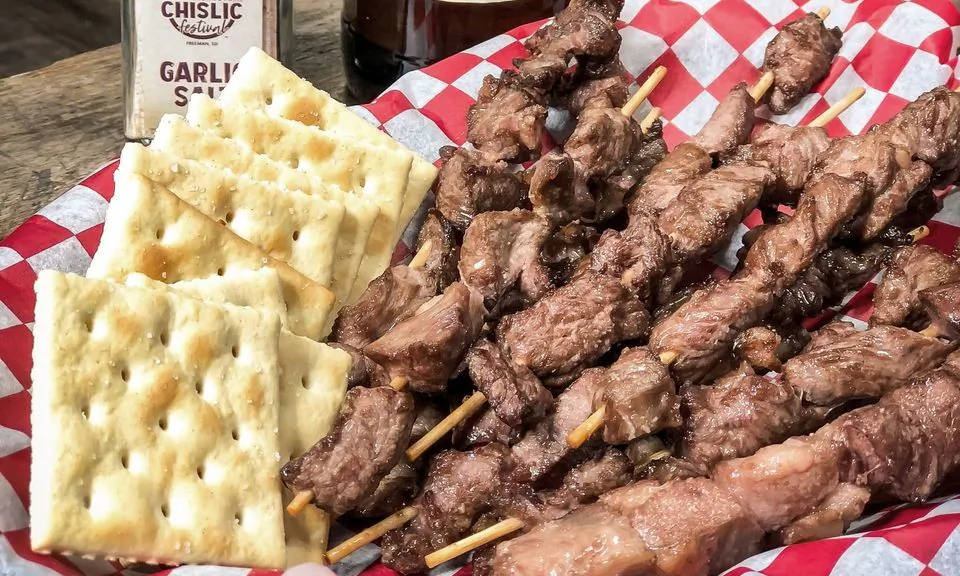Chislic is typically skewered cubes of lamb or mutton, either deep-fried or grilled, served with garlic salt and saltine crackers. (Jeremy Waltner/Waltner Media + Studios)
