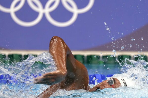 Tunisia's Ahmed Hafnaui swims