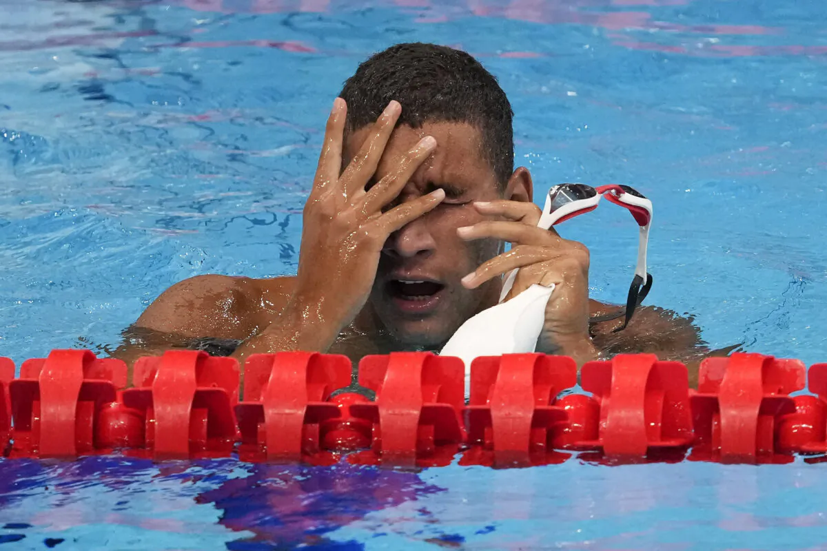 Ahmed Hafnaoui, of Tunisia, reacts after winning the final of the men's 400-meter freestyle at the 2020 Summer Olympics in Tokyo, Japan, on July 25, 2021. (Petr David JosekAP)