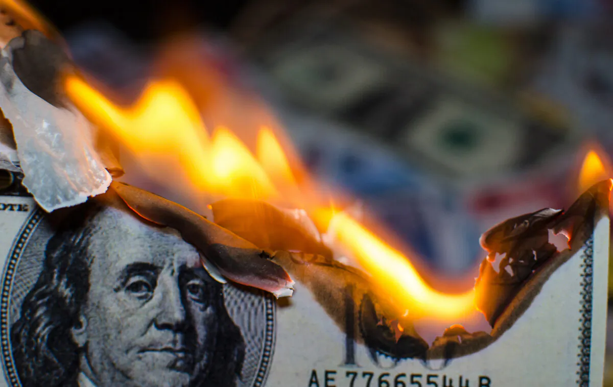 A $100 bill is on fire. GSI Exchange
