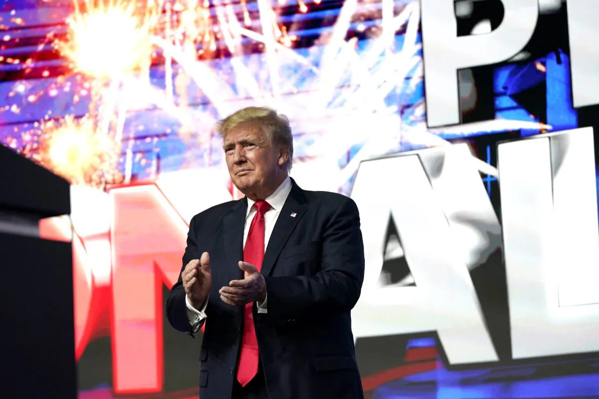 Former President Donald Trump applauds supporters prior to speaking at a Turning Point Action Summit in Phoenix, Ariz., on July 24, 2021. (Ross D. Franklin/AP Photo)