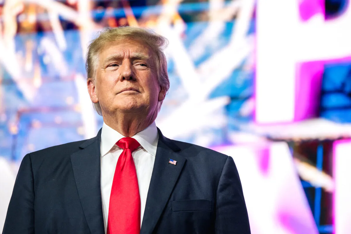 Former President Donald Trump makes an entrance at the Rally to Protect Our Elections conference in Phoenix, Ariz., on July 24, 2021. (Brandon Bell/Getty Images)