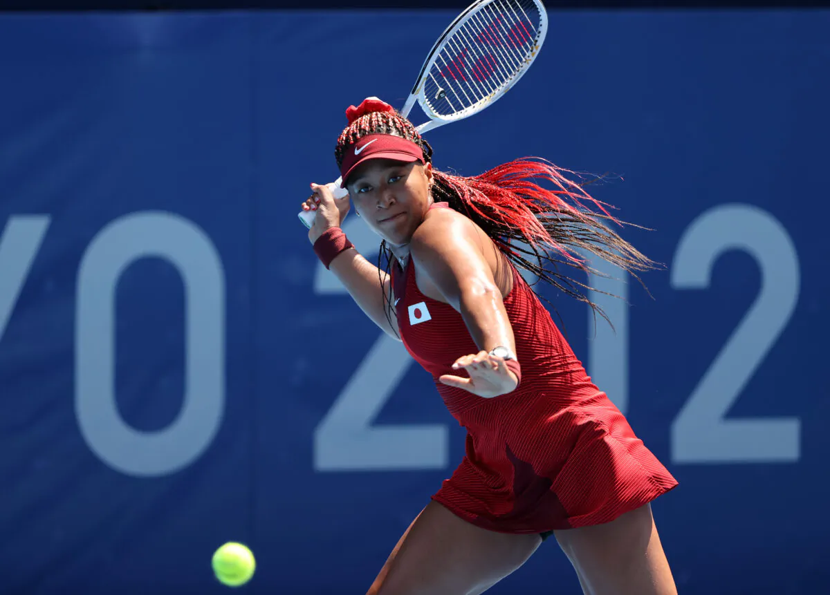 Naomi Osaka of Team Japan plays a forehand during her Women's Singles First Round match against Zheng Saisai of Team China on day two of the Tokyo 2020 Olympic Games at Ariake Tennis Park in Tokyo, Japan, on July 25, 2021. (Clive Brunskill/Getty Images)