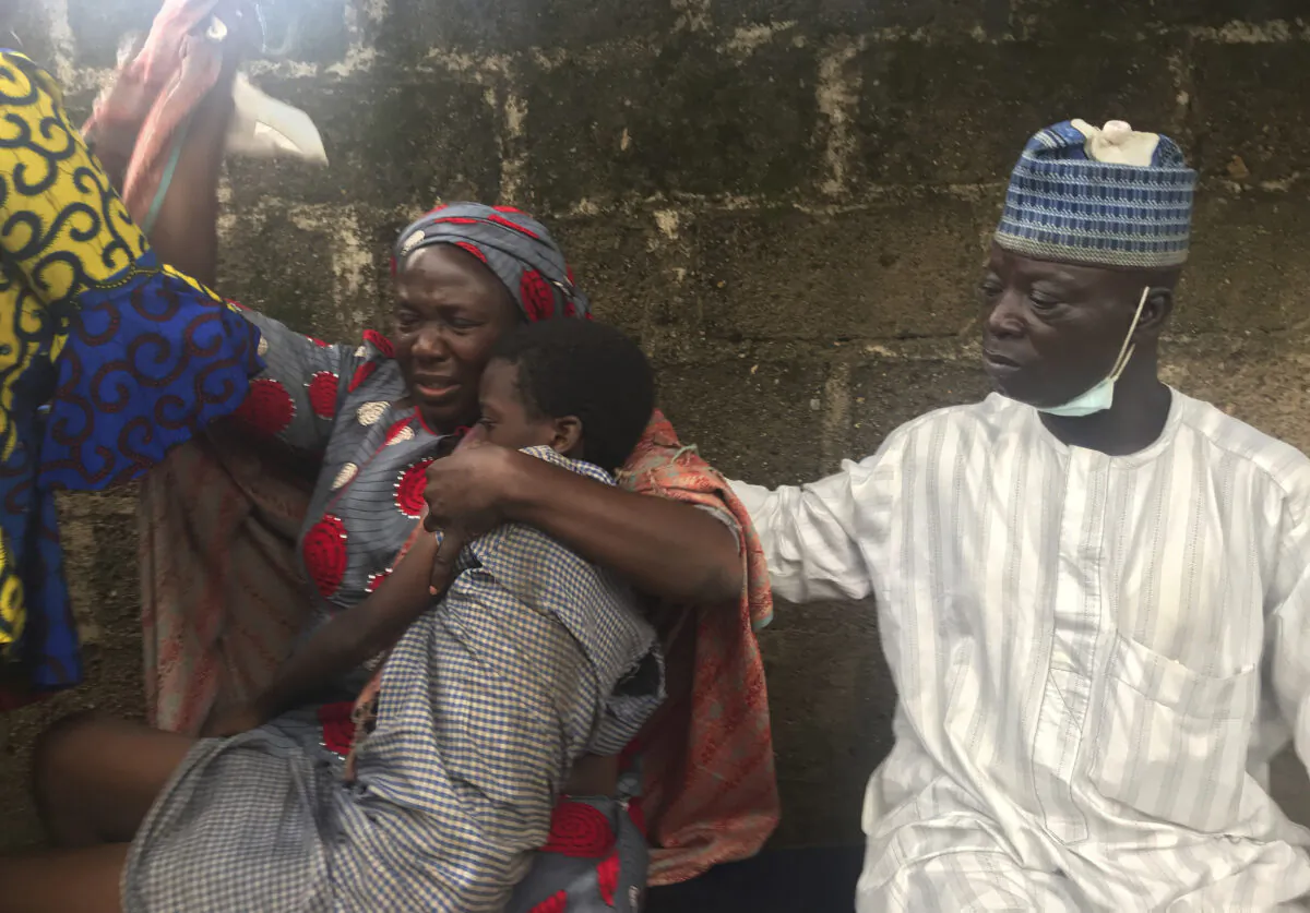 Parents are reunited with released students of the Bethel Baptist High School in Damishi, Nigeria, on July 25, 2021. (AP Photo)