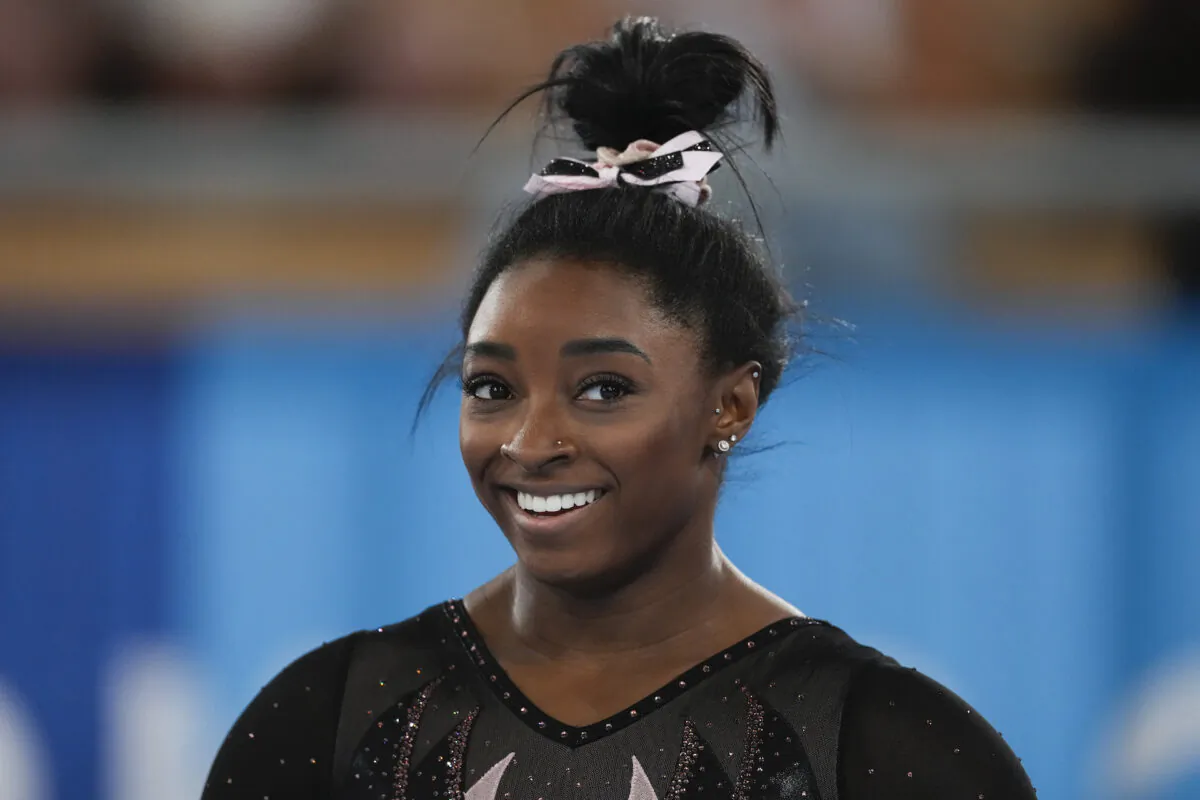 Simone Biles of the United States smiles as she trains for artistic gymnastics at Ariake Gymnastics Centre ahead of the 2020 Summer Olympics in Tokyo, Japan, on July 22, 2021. (Ashley Landis/AP Photo)