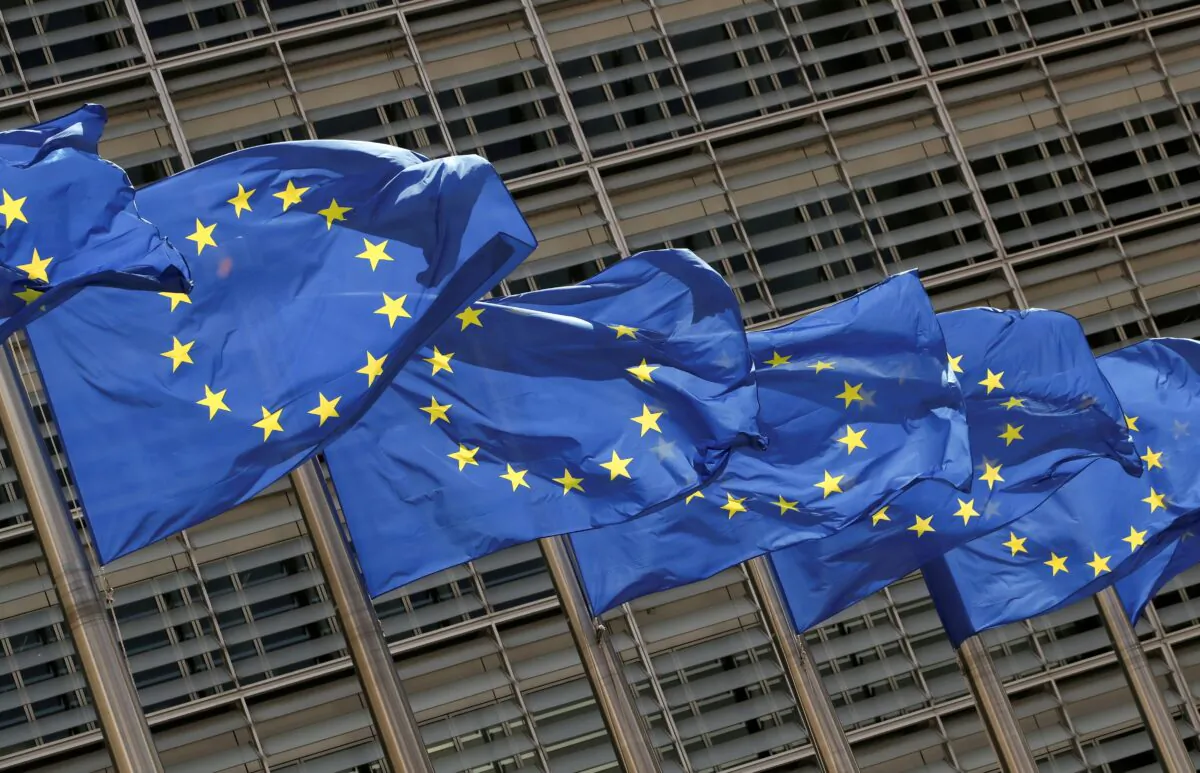 European Union flags flutter outside the EU Commission headquarters in Brussels on May 5, 2021. (Yves Herman/Reuters)