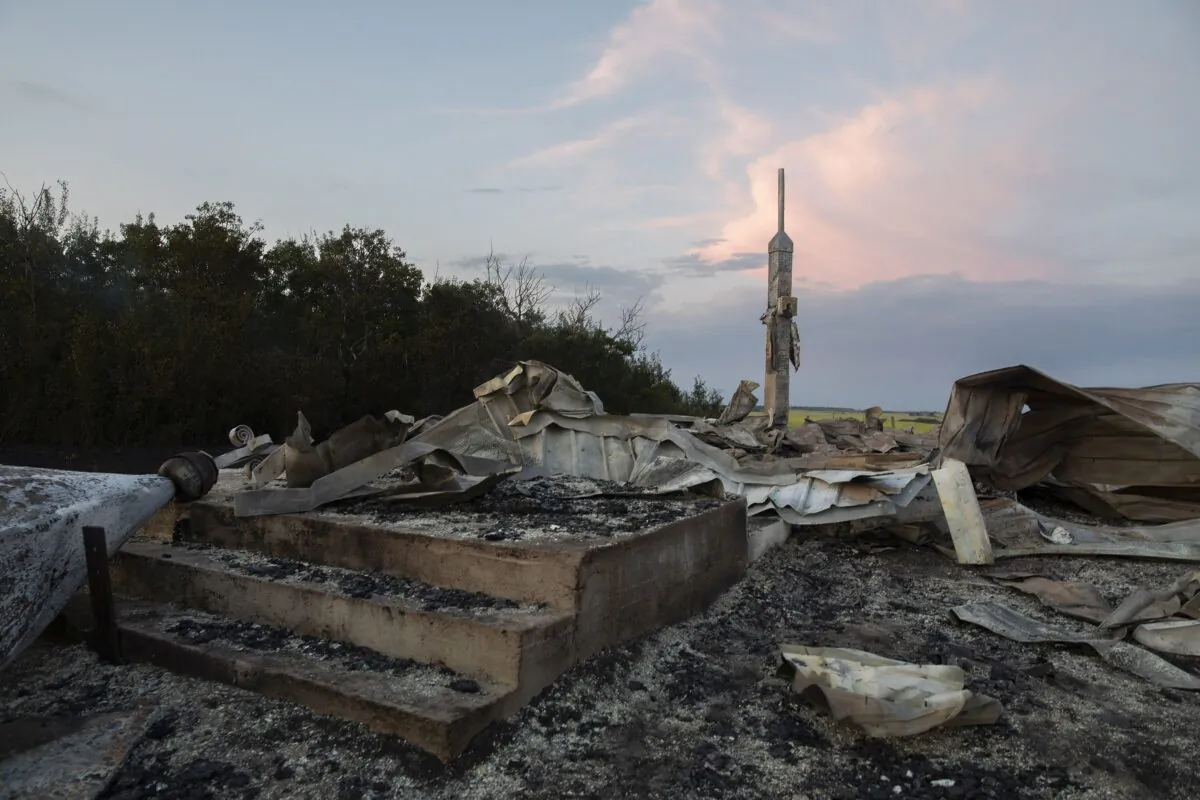 Ashes and debris are all that remain after a fire at the Holy Trinity Roman Catholic Church near Orolow, Sask., on July 8, 2021. (The Canadian Press/Kayle Neis)
