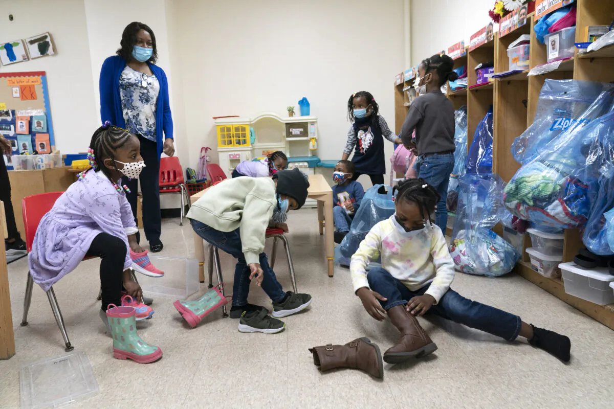 Pre-K students arrive for the school day at Phyl's Academy, in the Brooklyn borough of New York on March 24, 2021. (Mark Lennihan/AP Photo)