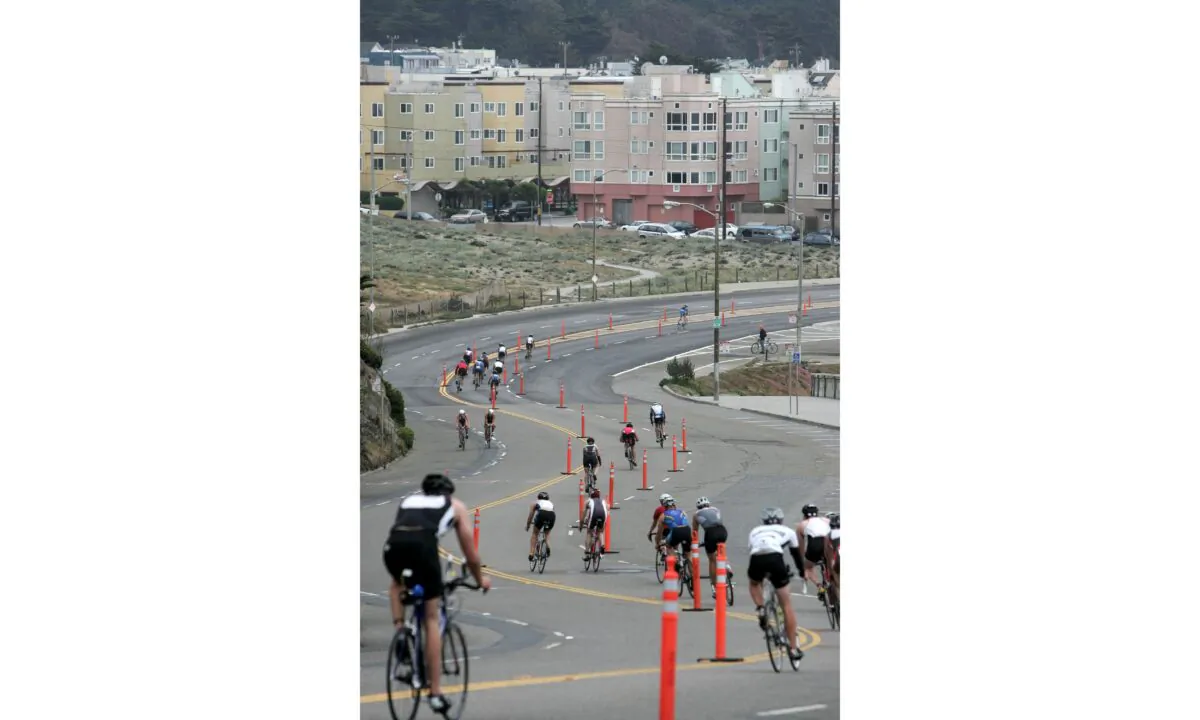 Athletes race down the north end of the Great Highway during the bike portion of the Escape from Alcatraz Triathlon in San Francisco, Calif., on June 3, 2007. (Jed Jacobsohn/Getty Images)