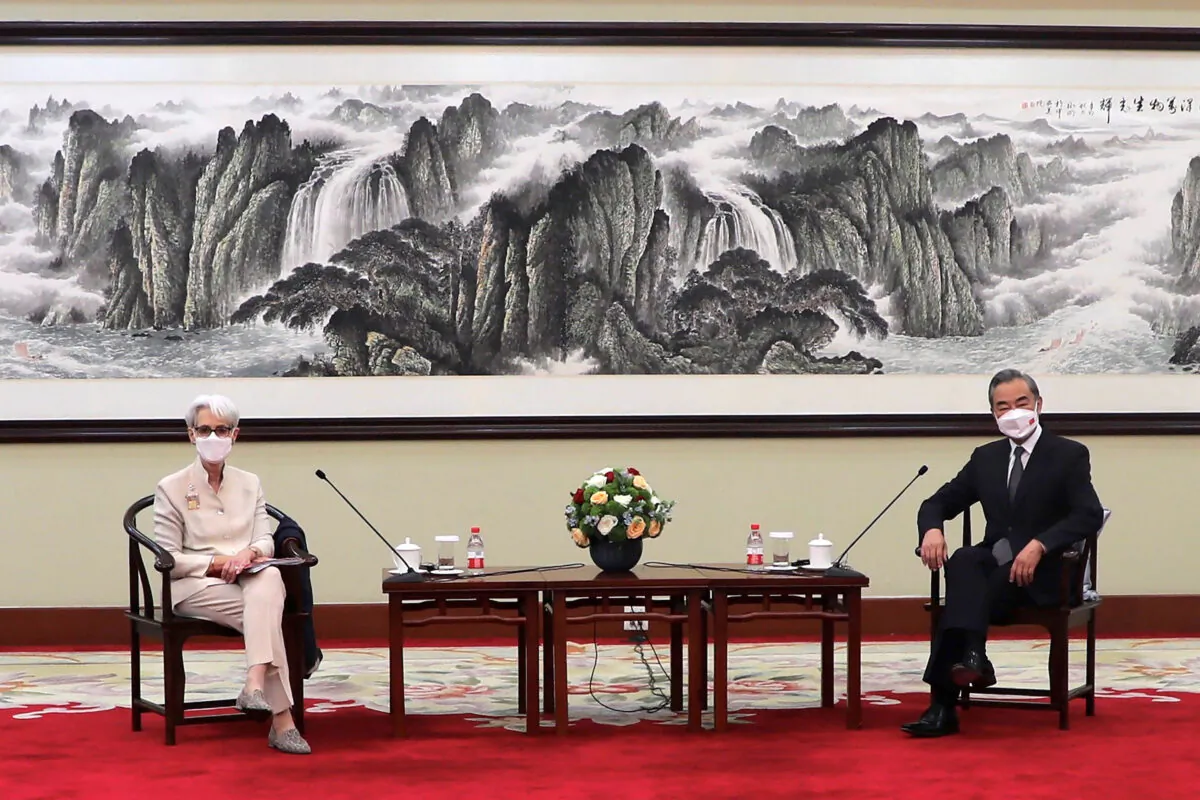 Deputy Secretary of State Wendy Sherman (L) and Chinese Foreign Minister Wang Yi sit together in Tianjin, China, on July 26, 2021. (Mark Schiefelbein/AP Photo)