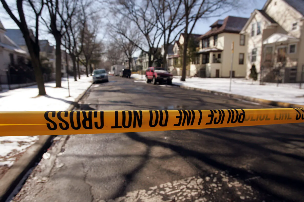 Crime-scene tape stops all but the residents at the end of the block where murder suspect Bart Ross lived on the city's northwest side March 11, 2005 in Chicago, Illinois(Photo by Scott Olson/Getty Images)