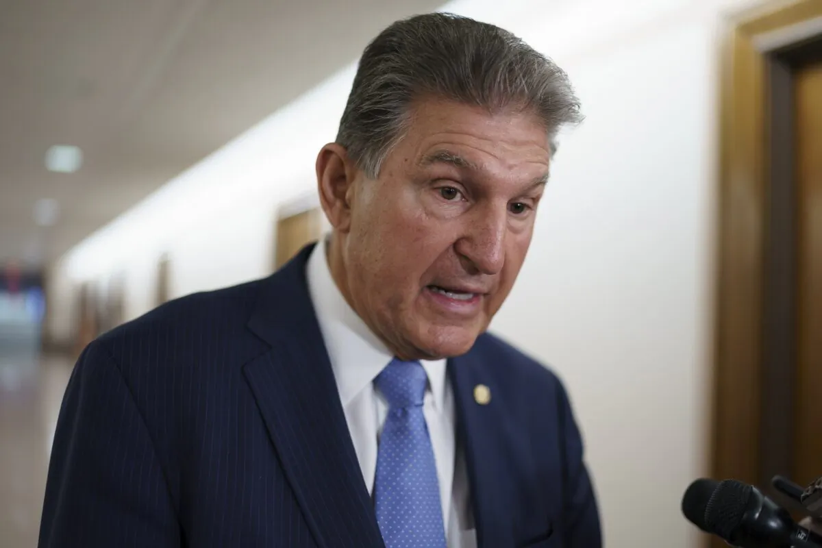 Sen. Joe Manchin (D-W.Va.) talks to reporters at the Capitol in Washington in a file photograph. (J. Scott Applewhite/AP Photo)