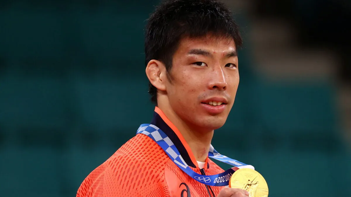Gold medalist Takanori Nagase of Japan poses with his medal after winning the Men’s Judo 81kg event at the 2020 Summer Olympics in Tokyo, Japan, on July 27, 2021. (Sergio Perez/Reuters)