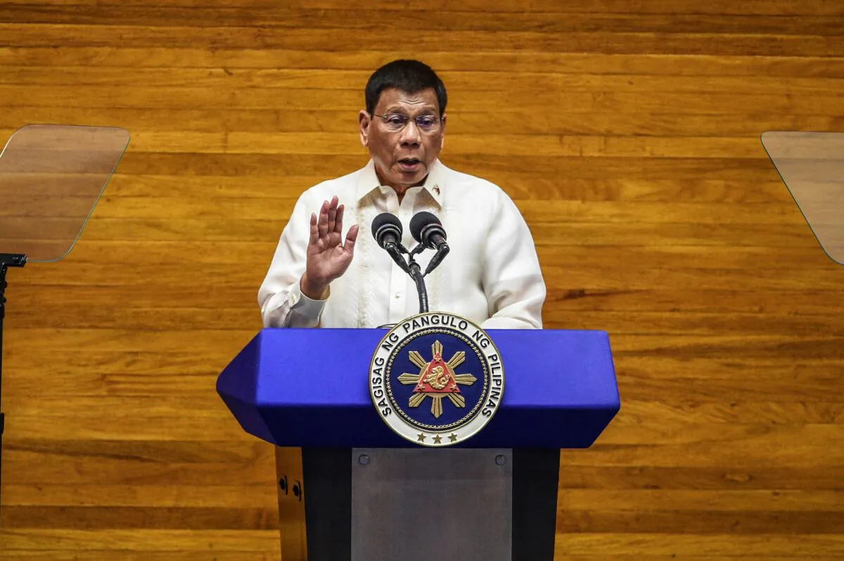 Philippine President Rodrigo Duterte gestures as he delivers his final State of the Nation Address at the House of Representatives in Quezon City, Philippines on July 26, 2021. (Jam Sta Rosa/Pool Photo via AP)