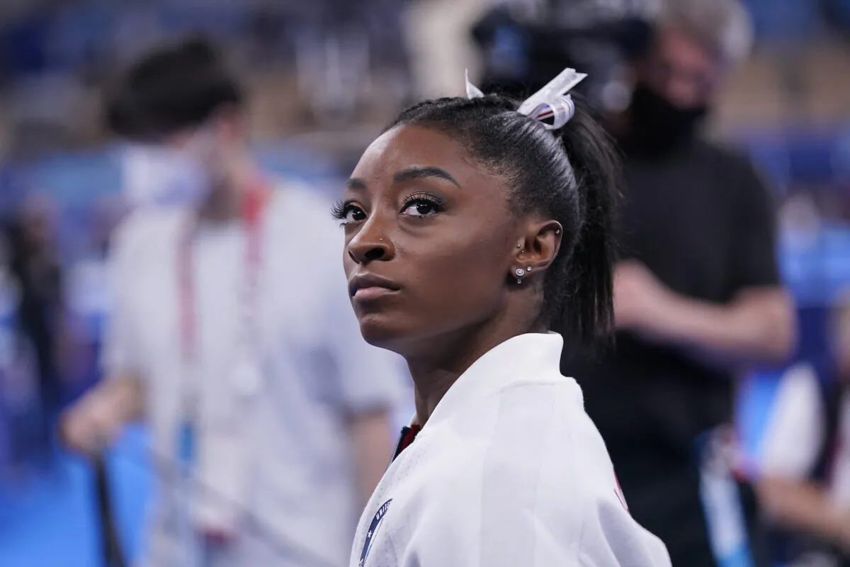 Simone Biles, of the United States, waits for her turn to perform during the artistic gymnastics women's final at the 2020 Summer Olympics, on July 27, 2021, in Tokyo. (Gregory Bull/AP Photo)