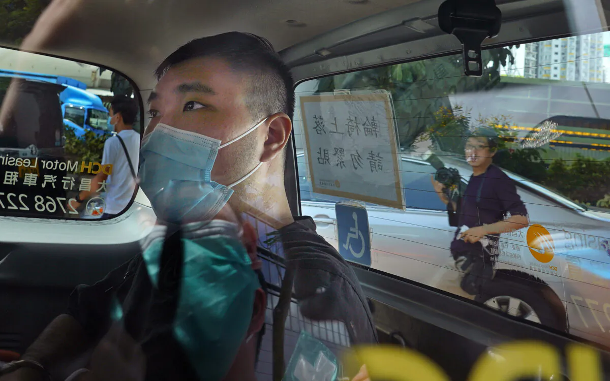 Tong Ying-kit arrives at a court in a police van in Hong Kong, on July 6, 2020. (Vincent Yu/File/AP Photo)